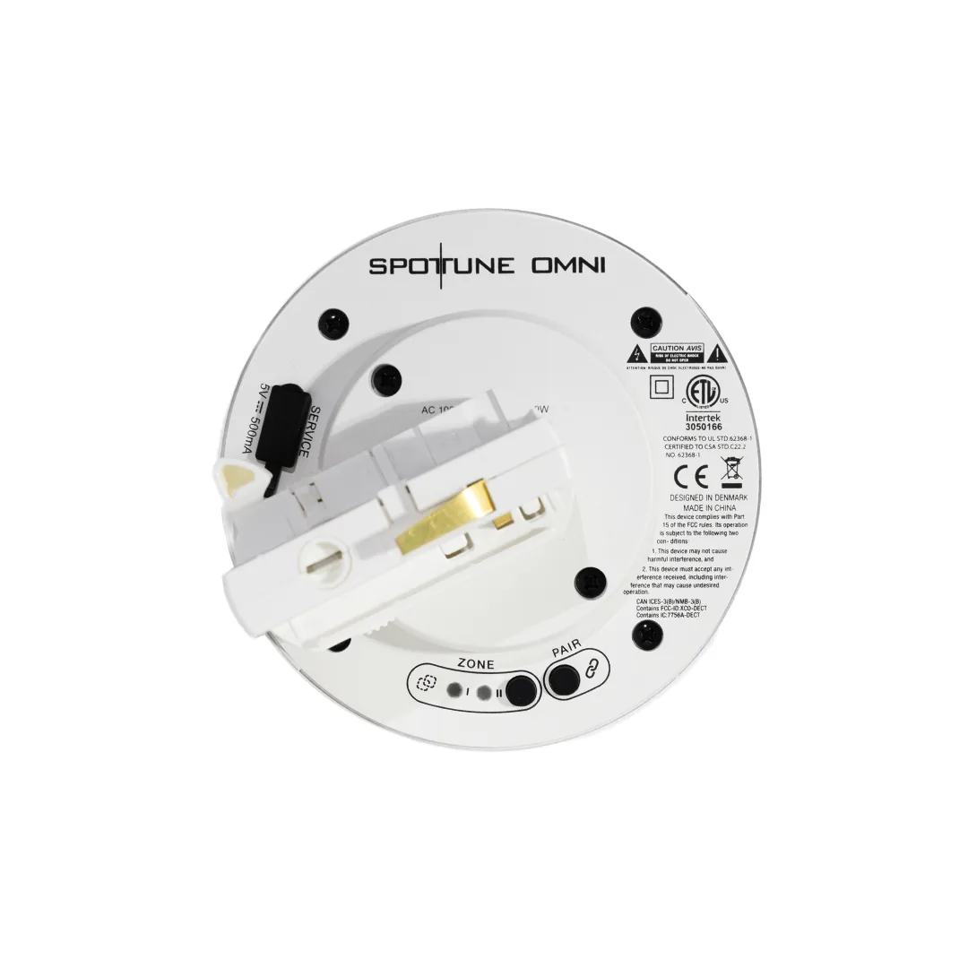 Vista superior de un Omni Track blanco: botones PAIR y de zona junto al adaptador GA69